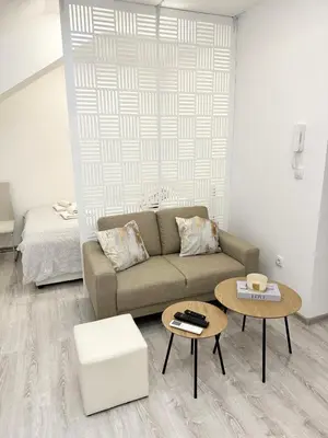 a living room with a couch and a table at Apartment M&S in Bosanski Novi
