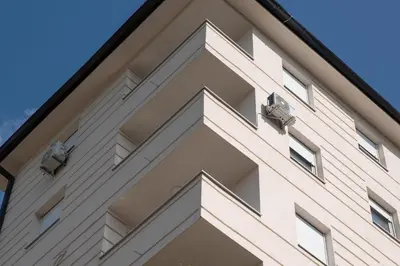 a facade of a building with windows at Apartman Milica in Doboj
