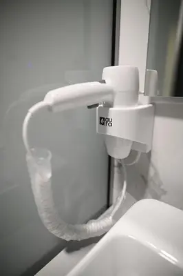 a close up of a toilet in a bathroom at Hotel LOBBY PLUS in Bihać