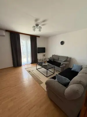 a living room with a couch and a table at Dream house in Laktaši