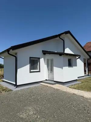 a white house with a black roof at Dream house in Laktaši