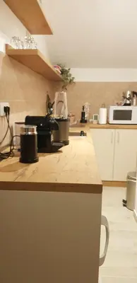 a kitchen with a counter with pots on it at Apartman M&B - Kuća za odmor-Karanovac in Topići