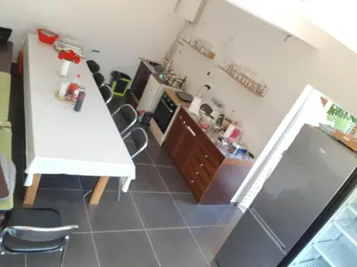 an overhead view of a kitchen with a white table and chairs at Apartman M&B - Kuća za odmor-Karanovac in Topići
