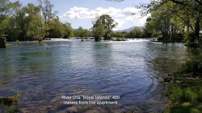 a river in the foreground withriver five new england islands masters from at Apartman EM-Bajkeraj in Bihać