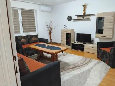 a living room with a table and a couch at Dinn in Jajce