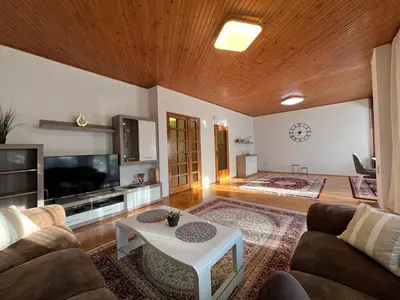 a living room with a couch and a table at Home Nur in Ivišovo Greblje