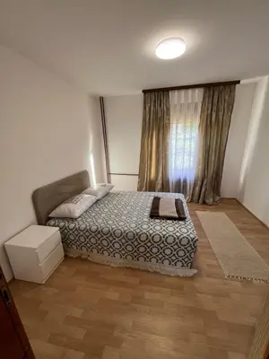 a small bedroom with a bed and a window at Home Nur in Ivišovo Greblje