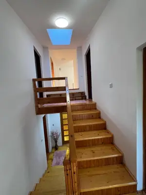 a staircase in a house with a blue light at Home Nur in Ivišovo Greblje