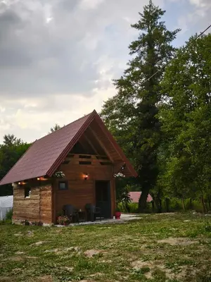 a log cabin with a brown roof at Janjske Otoke Brvnara Tiho Ognjiste in Šipovo