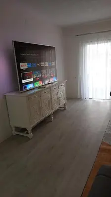 a living room with a large flat screen tv at Apartman ARIS in Bosanska Krupa