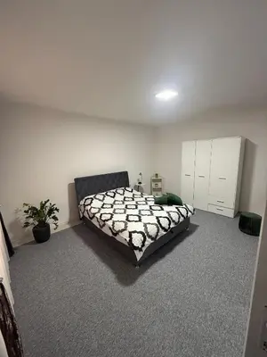 a bedroom with a large bed in a room at Renoviran i novo namješten Apartman in Velika Kladuša