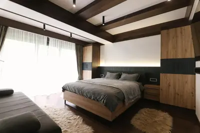 a bedroom with a bed and a large window at Mountain House LISINSKA ROSA in Brdo