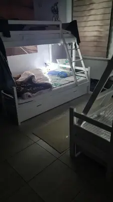 a bunk bed in a room with a window at Durmeo in Ripač