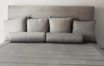 a couch with pillows sitting in a room at Wildlight in Bihać