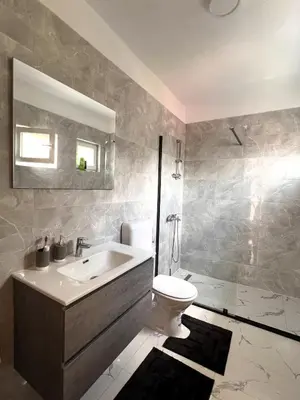 a bathroom with a sink and a toilet at Guest House 369 in Jajce