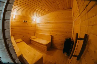 an empty wooden sauna with two benches in it at Djedovo Ognjiste,prenociste in Modriča