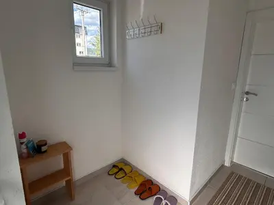 a room with a row of shoes on the floor at Vikendica Nuhanović - Vlašić in Vlasic