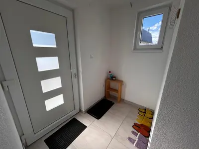 an empty room with a door and a window at Vikendica Nuhanović - Vlašić in Vlasic