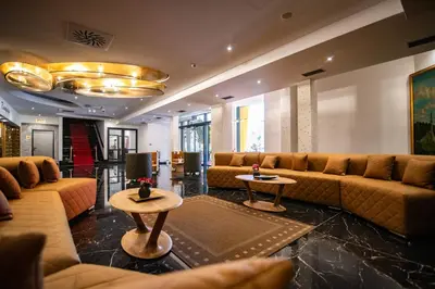 a large living room with couches and tables at Hotel President & SPA Maglaj in Maglaj