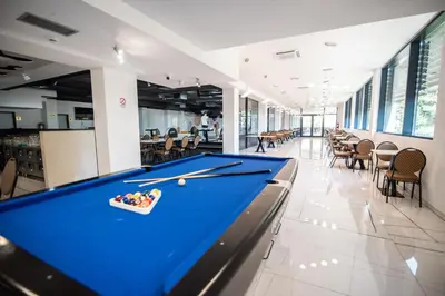 a pool table in the middle of a room at Hotel President & SPA Maglaj in Maglaj