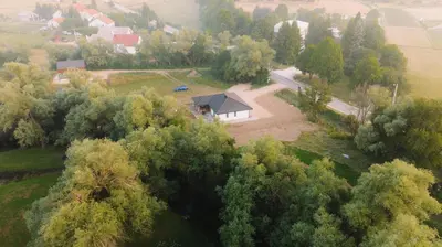 an aerial view of a house in the middle of trees at Villa Verde House by the River Sturba in Livno