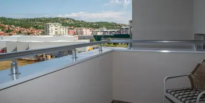 a balcony with a view of a city at Apartman Sunset Doboj in Doboj