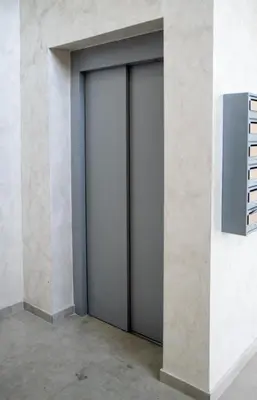 a pair of sliding doors in a wall at Apartman Sunset Doboj in Doboj