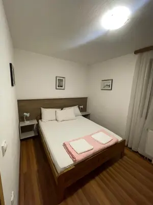 a bedroom with a bed with two towels on it at Elas in Banja Luka