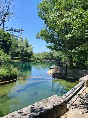 a view of a river with trees on the side at Al-Batten Vila Bihac in Bare