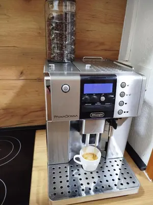 a coffee machine with a cup of coffee at Apartmani LIDER Visoko in Visoko