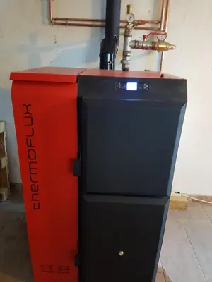 a red and black machine in a room at Holiday Home Villa Snježina in Vlasic