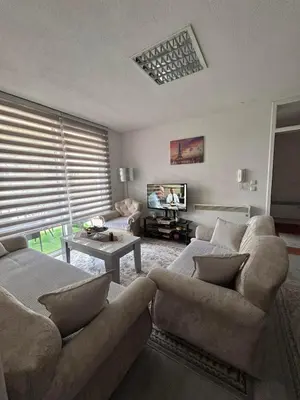 a living room with two couches and a tv at Apartment Alisa in Vlasic