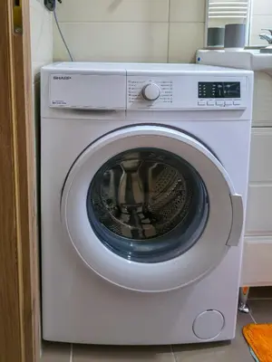 a white washer and dryer in a kitchen at Urban Nest in Jajce