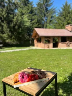 a plate of food on a table in a yard at Rancbl in Banja Luka