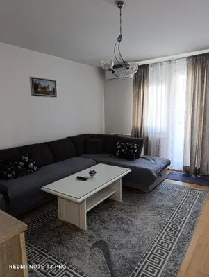 a living room with a couch and a coffee table at Apartman Phoenix in Banja Luka