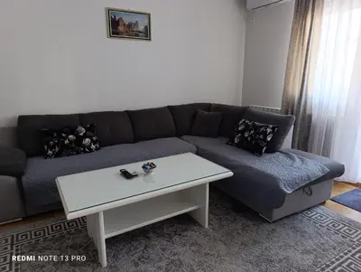 a living room with a couch and a coffee table at Apartman Phoenix in Banja Luka
