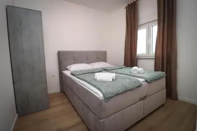 a bedroom with a bed with two towels on it at Kuća za odmor Ana in Prozor