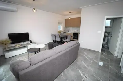 a living room with a couch and a table at Kuća za odmor Ana in Prozor