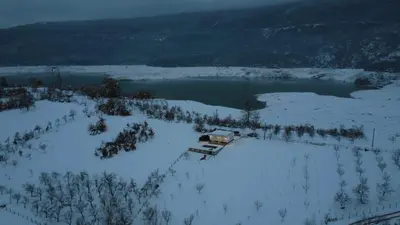 an aerial view of a lake in the snow at Kuća za odmor Ana in Prozor