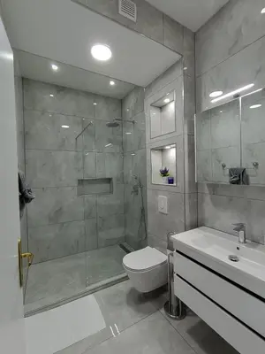 a bathroom with a shower and a toilet and a sink at Una Festa Apartment in Bihać