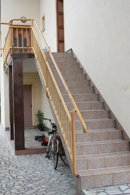 a staircase with a bike parked next to a building at Apartment Anastasija in Doboj