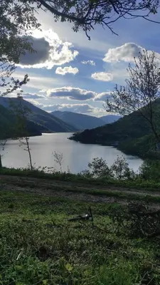 a view of a lake with mountains in the background at Cottage Arinda in Jajce