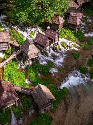 an aerial view of a model of a river with huts at Cottage Arinda in Jajce