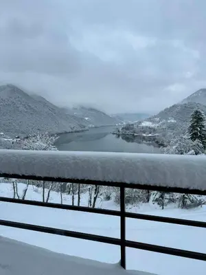 a view of a lake in the snow at Cottage Arinda in Jajce
