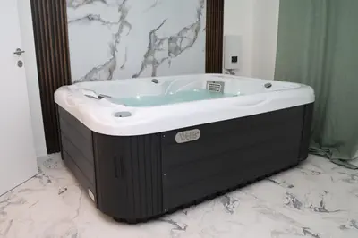 a large bath tub in a bathroom at Om relax in Prijedor