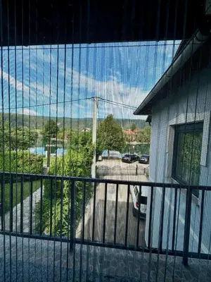 a balcony with a view of a parking lot at Apartman UnaTesnim in Bihać