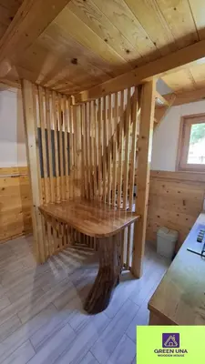 a room with a wooden table in a cabin at Green Una Wooden House in Kulen Vakuf