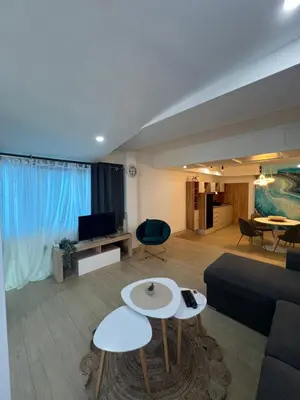 a living room with a couch and a tv at Apartman TRG, Prijedor in Prijedor