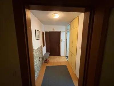 a hallway with a door leading into a room at Bihac Center Apartment in Bihać