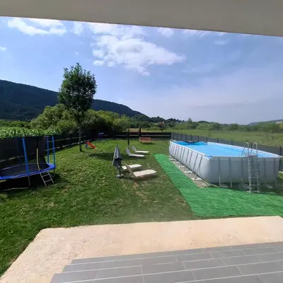 a view of a swimming pool in a yard at Nature flow Bihac in Otoka